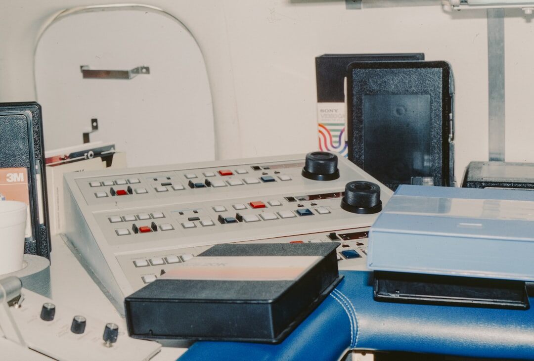 Broadcast control room with multiple video monitors and a switcher panel